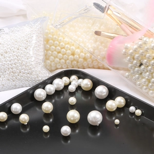 Mix of white and cream glossy ABS pearl beads in various sizes for DIY jewelry making