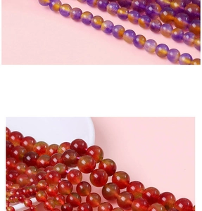 Macro detail of polished gradient purple and translucent reddish-brown natural stone beads