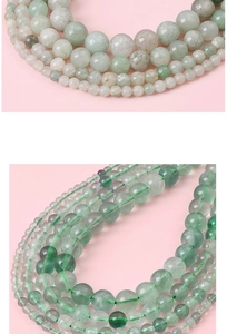 Macro shot of natural round gemstone beads in varied green shades for DIY jewelry crafts