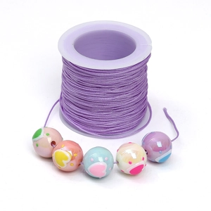 DIY purple braided cord roll with colorful patterned macaron beads for jewelry making