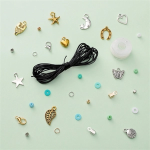 Macro shot of assorted alloy charms and jewelry findings for DIY craft making projects