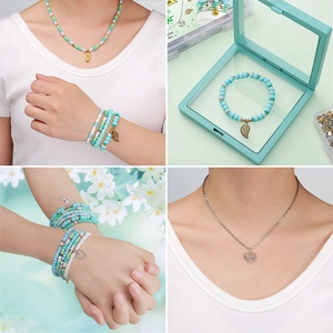 Detail view of mint green DIY jewelry set with clay beads, heart charms and storage box