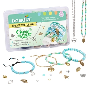DIY jewelry making kit with green clay beads, metal charms, and storage box set