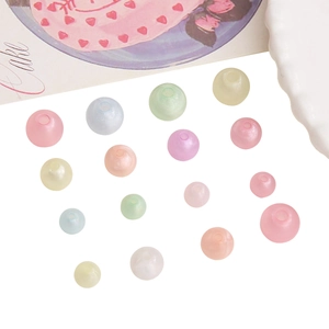 Macro detail of mixed macaron acrylic luminous beads for DIY jewelry making and bracelets