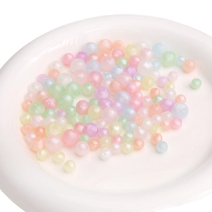 Macro shot of colorful pastel macaron acrylic beads with threading holes for DIY jewelry