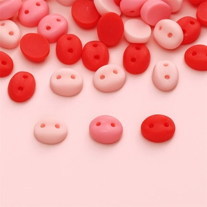 Macro detail of pig nose shaped resin buttons for DIY plush toys in assorted pink colors