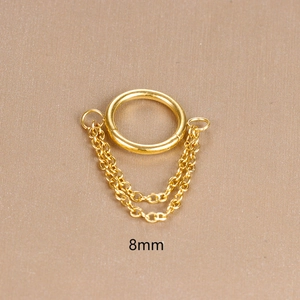 Macro shot of 8mm gold stainless steel hinged ring with double chain tassel details