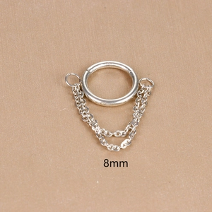 Detailed macro view of 8mm silver stainless steel double chain tassel piercing jewelry