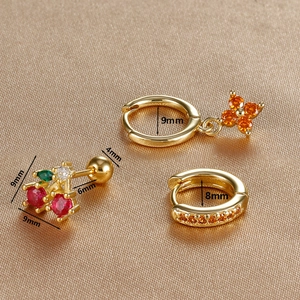 Macro shot of gold-plated clover and cherry zircon earrings set with size measurements
