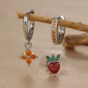 Detailed set of silver hoop earrings with orange clover charms and red heart stud