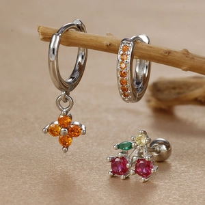 Detailed set of silver clover clover charms, orange rhinestones and cherry stud earrings