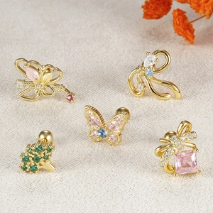 Exquisite copper bow earrings set with colored cubic zirconia and screw-back cartilage studs