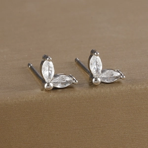 Detail shot of brass gold-plated flower stud earrings with marquise-cut zircons