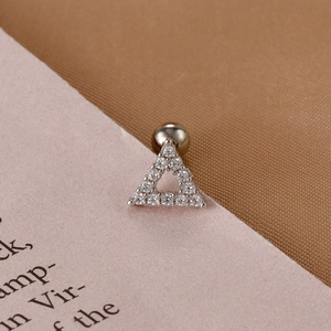 Macro view of silver triangle stud earring with clear cubic zirconia and ball back