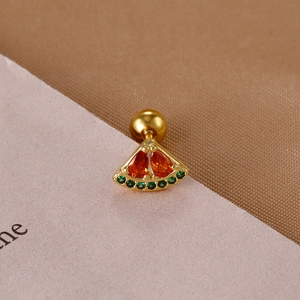 Detailed macro view of watermelon-shaped earring with red gems and green crystals