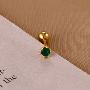 Macro shot of gold stainless steel stud earring with round green zircon and ball screw back