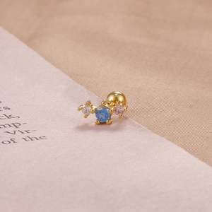 Detailed view of gold-plated stud earring with three multicolor cubic zirconia stones