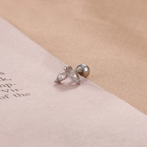 Macro shot of silver butterfly stud earring with marquise cut stones and screw ball back