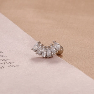 Detail of silver marquise cut zircon ear stud with five stones in fan shape on curved bar