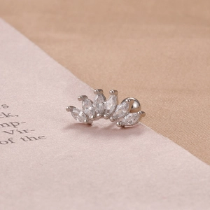 Detailed view of silver curved cartilage stud with six marquise-cut marquise stones
