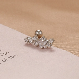 Macro detail of silver star-shaped zircon ear stud with secure screw ball back closure