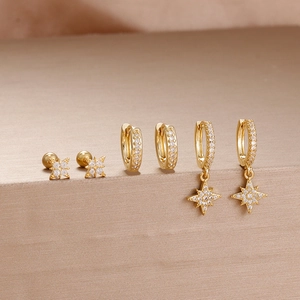 Detail view of gold-plated stainless steel star earrings set with zircon stones