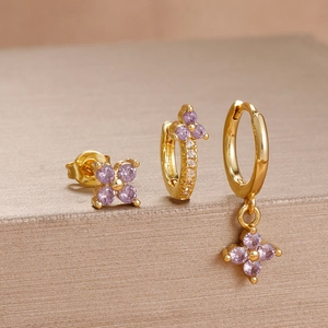 Three-piece set of gold stainless steel earrings with purple zircon floral charms