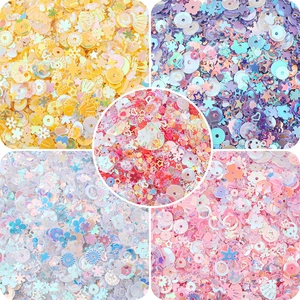 Macro view of colorful snowflake and star sequins for DIY crafts and jewelry making