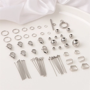 Polished stainless steel jewelry making kit with lobster clasps and jump rings in a tray