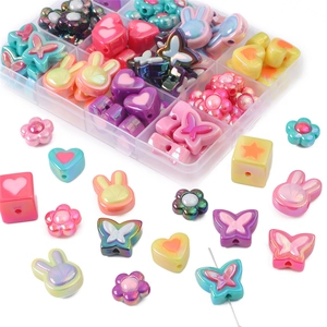 Colorful DIY acrylic bead set with butterfly and rabbit shapes in a storage box
