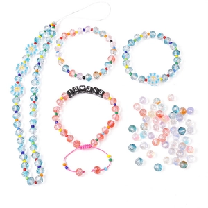 Close-up of faceted glass crystal beads and bracelets for DIY jewelry making kits
