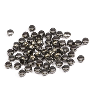 Flat lay of small black metallic spacer beads for DIY jewelry and bracelet making