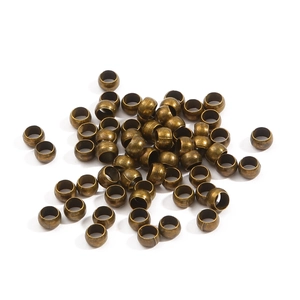 Macro view of vintage bronze jewelry spacers and metal cylinder beads for DIY bracelets