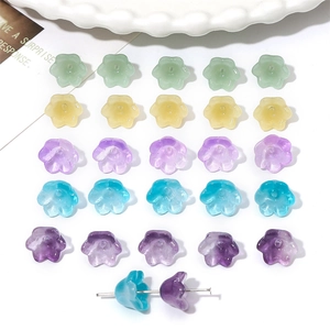 Macro detail of lily of the valley glass beads in gradient colors for DIY jewelry making