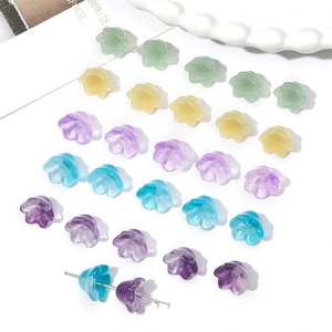Macro view of gradient lily of the valley glass beads with center holes for DIY jewelry