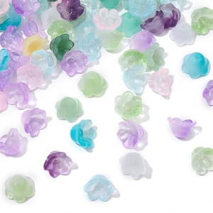 Macro shot of lily of the valley glass beads in gradient pastel colors for DIY jewelry