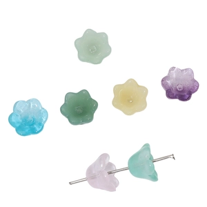 Macro view of bell orchid gradient glass beads for DIY jewelry with metal needle pin