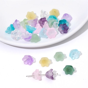 Macro shot of colorful gradient lily of the valley glass beads for DIY jewelry making