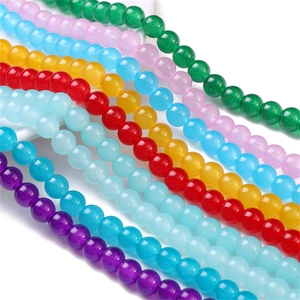 Close-up of colorful round glass jelly beads for DIY jewelry making and handmade crafts