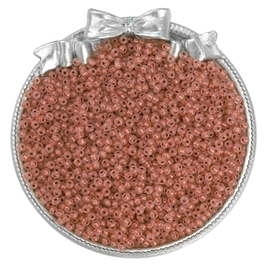 Top view of high-quality cinnamon seed beads neatly arranged in a silver metal display tray