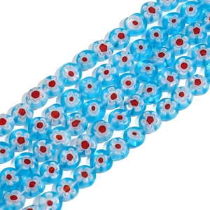 Macro detail of blue and white millefiori glass beads for handmade jewelry DIY crafts