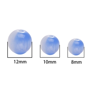 Macro view of blue cat-eye resin beads in 8mm, 10mm, and 12mm sizes for DIY jewelry