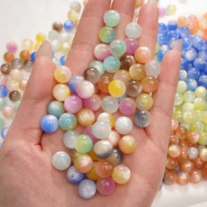 Mix of colorful round cat eye resin beads for DIY jewelry making and handmade crafts