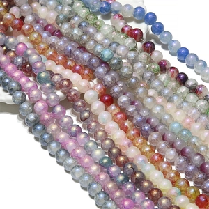 Close-up of Aurora Blue cracked glass beads showing internal textures for DIY jewelry