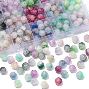 Macro detail of mixed color cracked glass beads in storage box for jewelry DIY