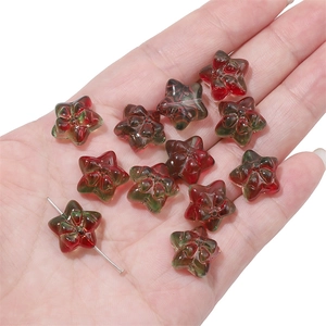 Macro shot of star-shaped resin beads with red and green mixed textures for DIY jewelry