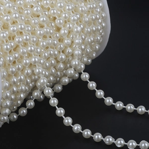 Double-row cream ABS faux pearl bead chain on a large spool for DIY bridal dress decoration