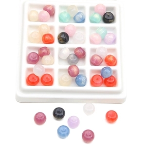 Colorful resin starry round beads for DIY jewelry making in a white display tray