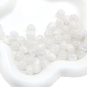 Macro detail of iridescent translucent resin stardust beads for DIY jewelry making projects