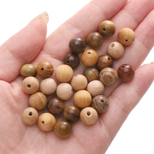 Macro detail of various natural wood beads with unique grains for DIY jewelry making